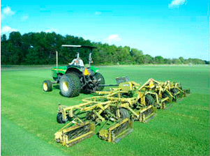 Reel mower cutting Houston Grass South turfgrass before harvesting at our family farm in Bay City TX